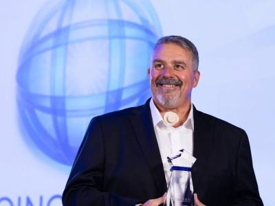 NSCN's CEO, Doug Bungay, holding Catalyst Award