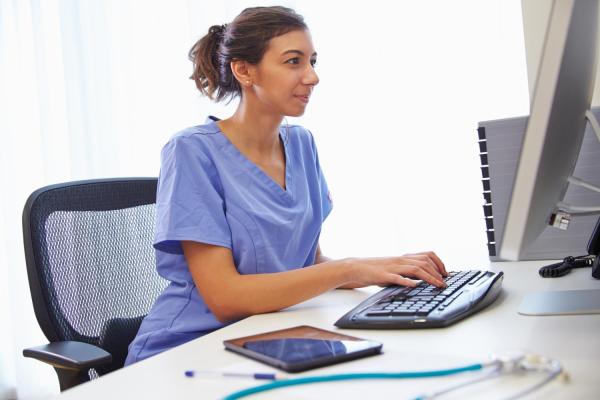 nurse in front of computer